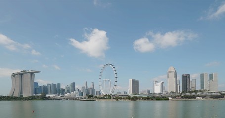 Timelapse of clouds on blue sky over panorama of Singapore