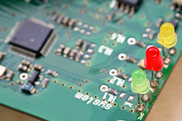 Three colored LEDs on a printed circuit board.