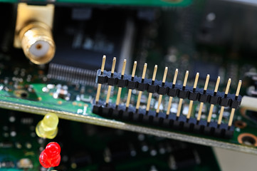 A series of plug connectors on a printed circuit board.