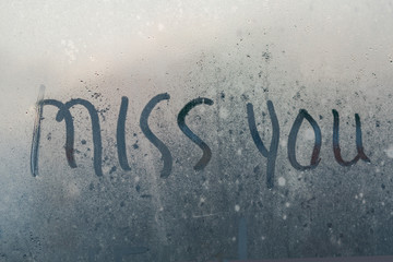 The inscription on the misted glass miss you