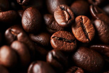 Close up of roasted coffee beans for background, texture and design. Selective focus.