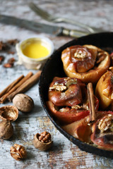 Baked apples with cinnamon and honey. Selective focus. Macro.