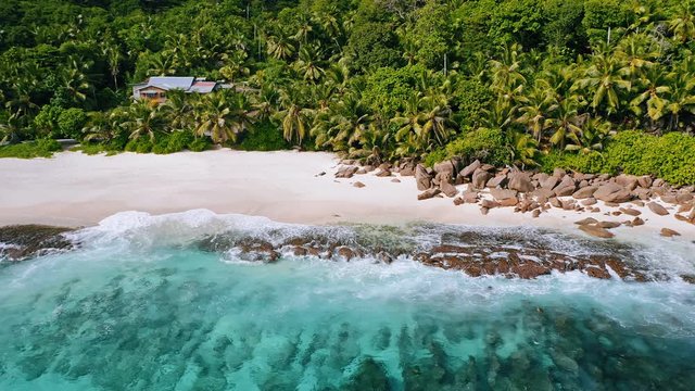 Aerial 4K drone pano footage of tropical sandy beach at Mahe island, Seychelles
