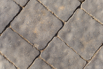 Paving from tiles. Graphic element on a stone. Construction product.	