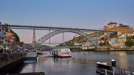 Fototapeta na wymiar Portugal. Porto Evening. View of the Ponte Luis I Bridge from Ribeira Square