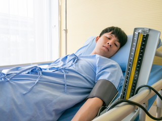 Professional physician use sphygmomanometer or manometer to measure blood pressure gauge for check...