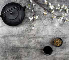 Japanese iron teapot on a grey stone board
