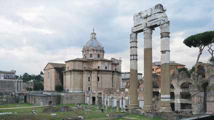 Fototapeta na wymiar The Roman Forum (Foro Romano or Forum Magnum) surrounded by the ruins