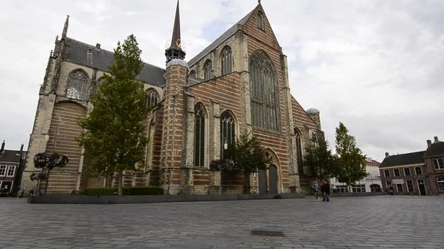 Goes, region of Zeeland, Holland. August 2019. View of three-fourths of the facade of the imposing church of Maria Magdalenakerk. Tilt movement.