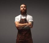Confident barber looking at camera