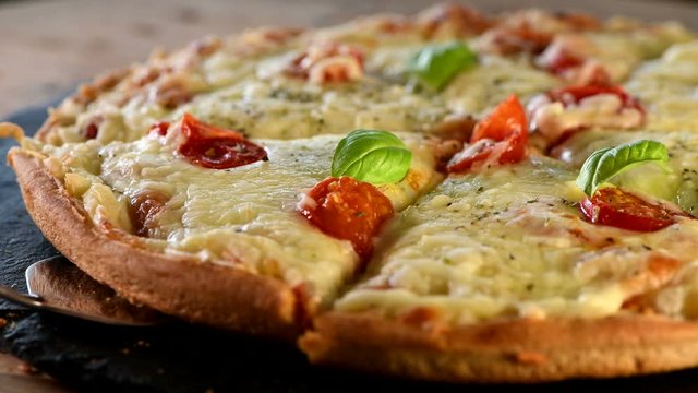Italian pizza with mozzarella cheese, basil and cherry tomatoes