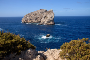 view of single rock in sea