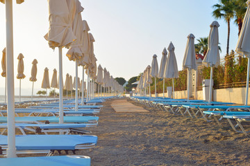 Folded umbrellas on the beach