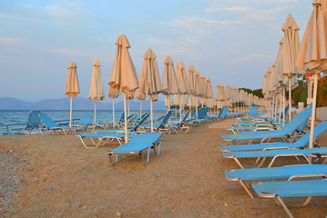 Folded umbrellas on the beach