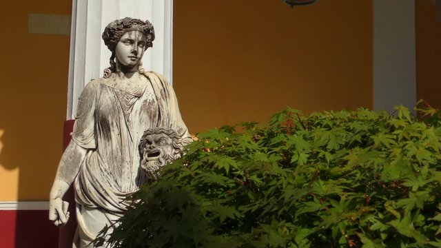 The statue of the Muse of Melpomene with a tragic mask in his hands in the palace of Achilleion built by the Empress of Austria, Elizabeth (Sissi). Corfu island, Greece.