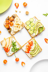 sandwiches set on white table background top view