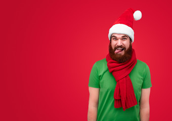 Playful man in colorful Christmas outfit