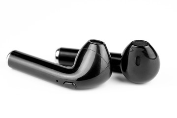 Black wireless bluetooth headphones on a white background.