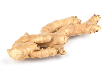 Fresh ginger root over a white background.