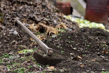 shovel and soil in garden