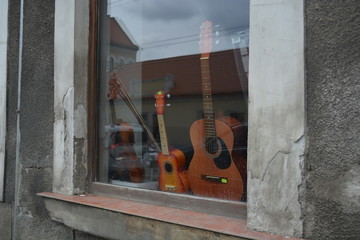 old guitars on window