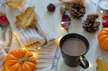 Autumn still life with pumpkins, leaves and pinecone