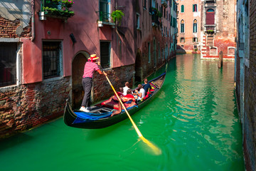 Fototapeta na wymiar Gondolas on Canal in Venice, Italy