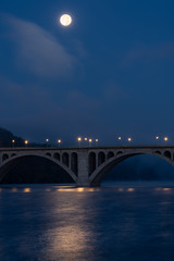 Fototapeta na wymiar Waning Full Moon Over Key Bridge and the Potomac River Before Dawn