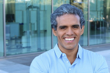 Ethnic businessman with salt and pepper hair