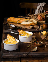 french onion soup, melted cheese and slice of baguettefrench onion soup, melted cheese and slice of baguette