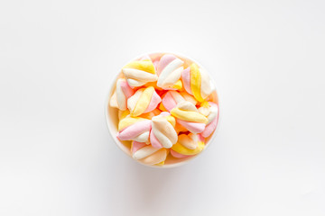 Fluffy dessert. Marshmallows in plate on white table top view space for text