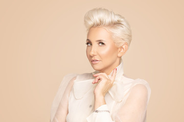 Beauty portrait of elegant adult blonde lady.