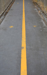 Yellow line on Overpass for walk across the road in Bangkok, Thailand.