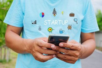 Man is using mobile phone.