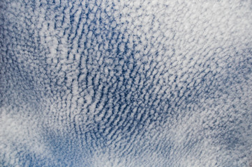 Pattern cloud over a deep blue sky