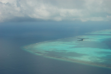 A large atoll seen from a hydroplane in the Maldives