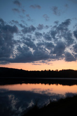 Sunset on The Lake in Vermont. Beautiful nature retreat. Sunset reflected in the water. Calming and relaxing escape.