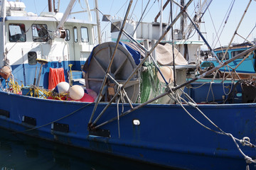 Close view of a section of fishing trawler docked in a harbor