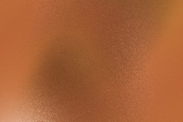 Old brushed brown metallic wall with scratched surface, abstract texture background