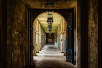 Arched walkway corridor with gates
