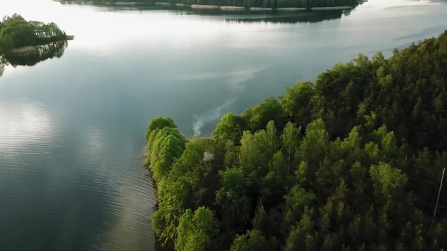 Aerial view of grill smoke at the shore of wdzydze lake in Poland.