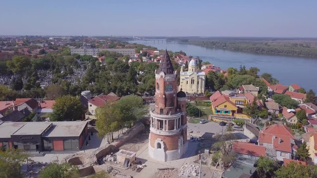 Orbiting aerial 4k shot of Gardos Tower in Zemun Old city, Danube river