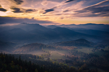 Fog on the mountains during sunset in autumn