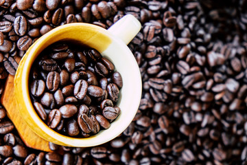 Cup of coffee with coffee beans