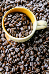Fototapeta premium Cup of coffee with coffee beans