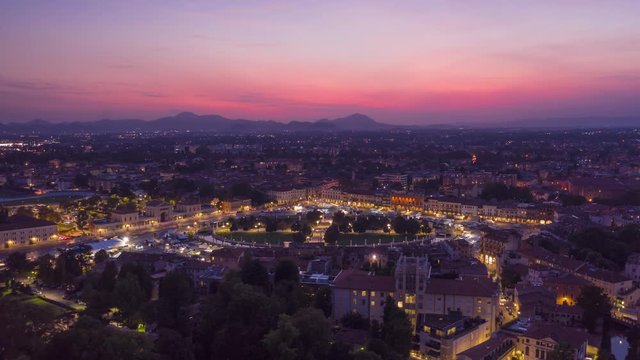 A BEAUTIFUL BIRD VIEW HYPER LAPSE / TIME LAPSE OF THE CITY DURING A SUNSET , SHOTTED WITH A DRONE. PADUA ITALY
