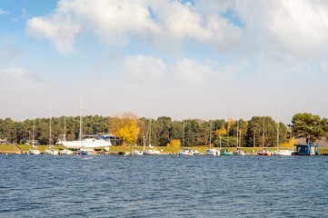 Fototapeta na wymiar Harbor shore with yachts and boats