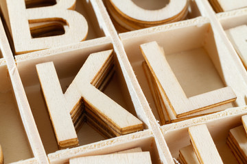Alphabet letters in wooden box, top view