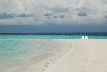 A beach for two at the sand bank of Ranveli Island, the Maldives
