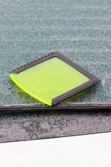 Scraper using to scrape ice from car window, winter problems in transportation concept